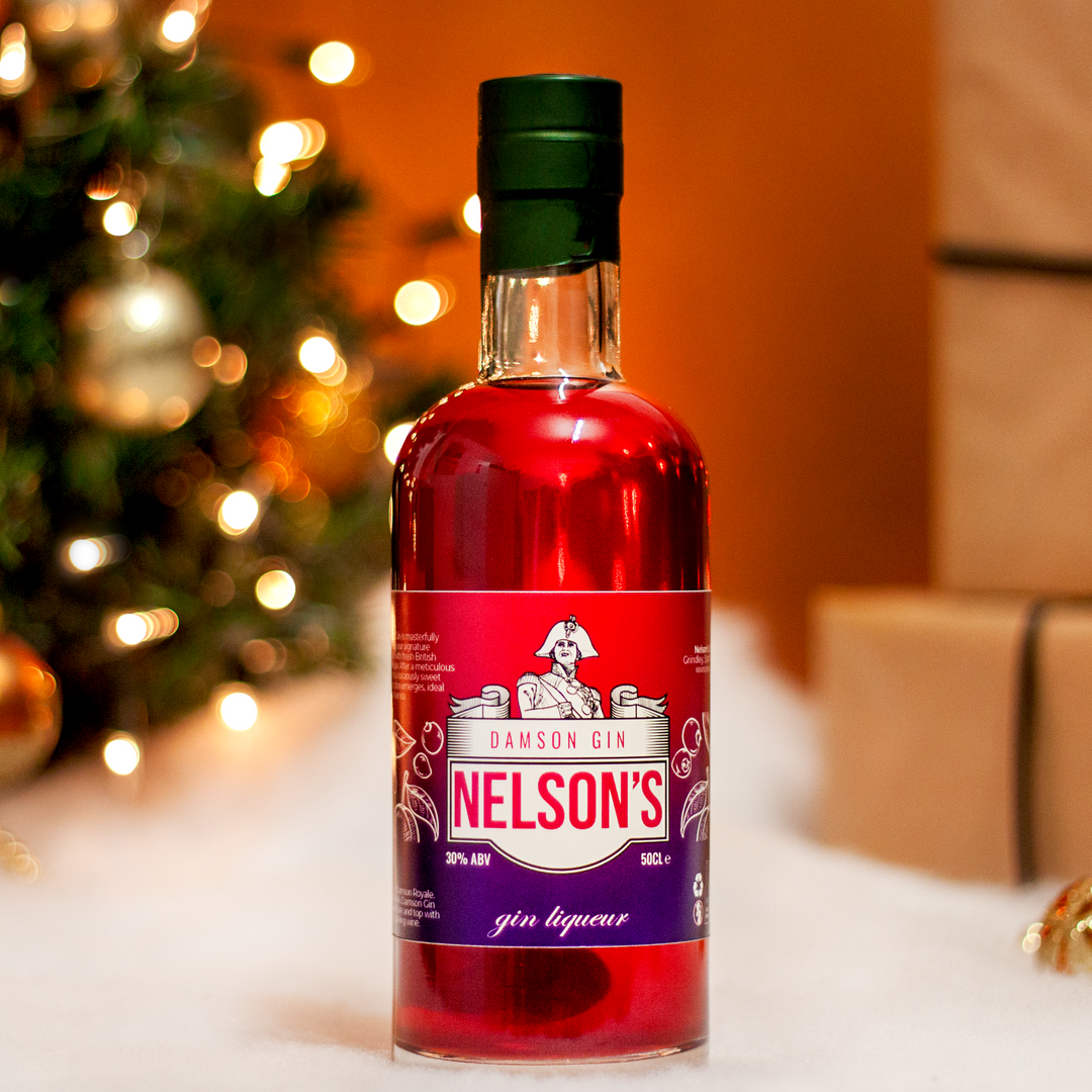 Nelson's Damson Gin Liqueur in front of copper Christmas backdrop. 